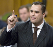 Conservative MP James Moore responds during Question Period in the House of Commons in Ottawa in this 2006 file photo. Mr. Moore denied allegations he was checking out 'scantily clad' women on his laptop computer in the House of Commons.