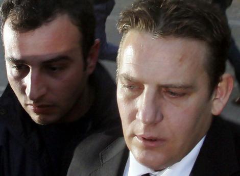 Briton John Hogan ... jumped from a balcony with his two children.